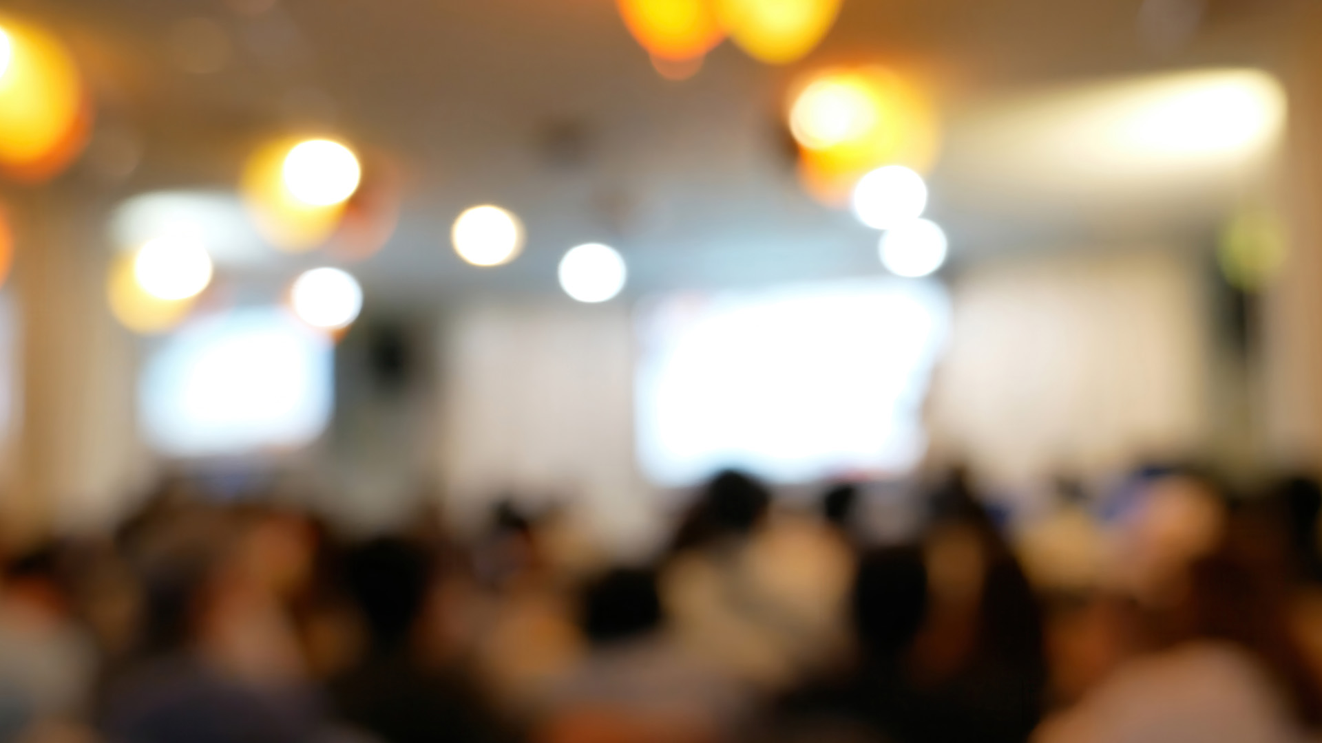 Blurred background people join seminar business event in auditor